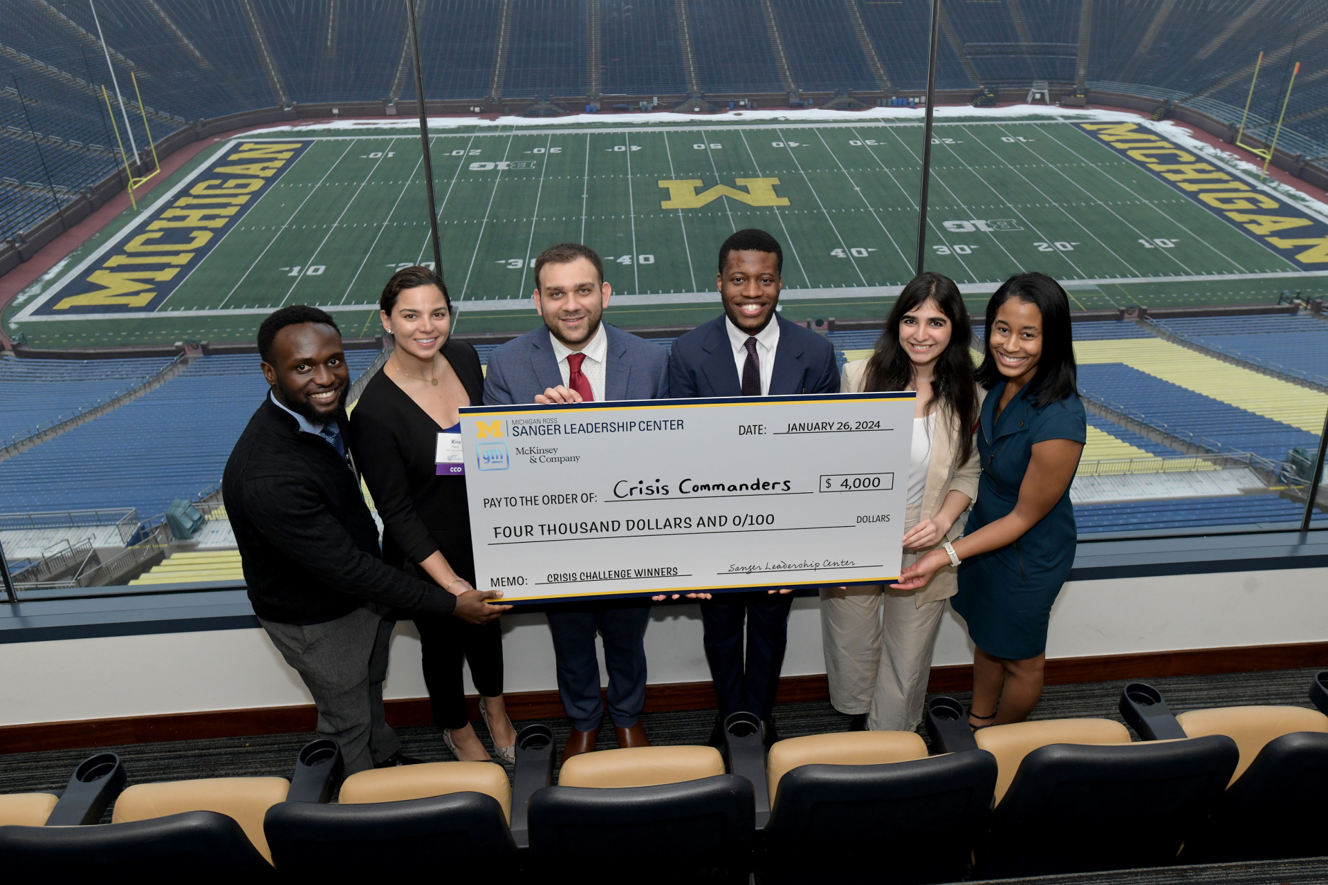 The Crisis Commanders posing with their check