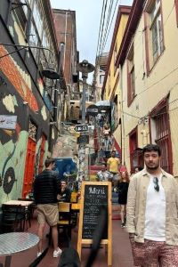 Photo of a Michigan Ross OMBA student standing in a marketplace in Chile. 