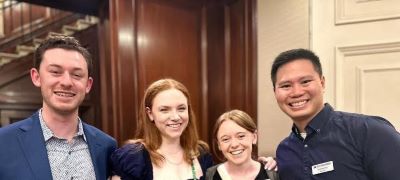 Photo of three Michigan Ross Online MBA students standing with Chilean tour guide.