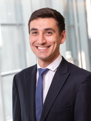 Esteban in a headshot with the Ross building in the background