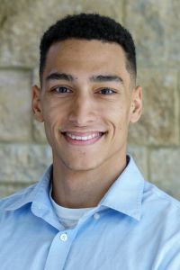 Photo of William Reese Marsh Jr Michigan Ross WMBA student wearing a light blue shirt with short dark hair and smiling