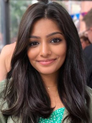 Woman with long dark hair smiling