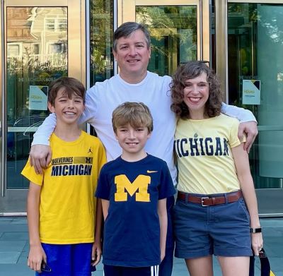 Amy and her family in front of the Ross building