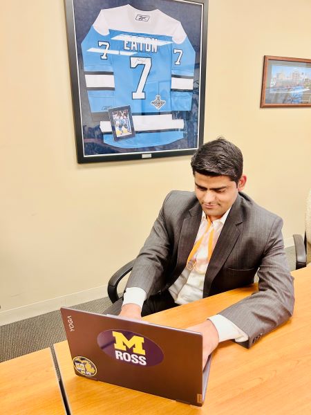 A student types on his laptop