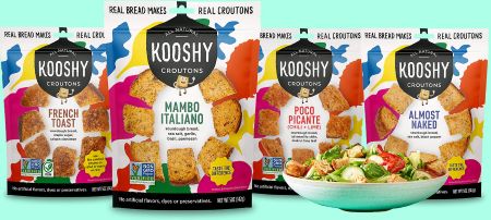 Kooshy crouton flavors displayed beside a bowl of salad