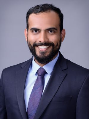 Man in a suit with a gray background