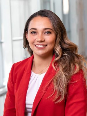 Woman in a red blazer in the Ross building