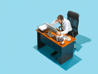 Stressed business man at desk