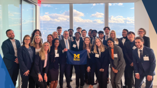 group of students holding a ross flag