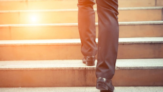 man walking up steps