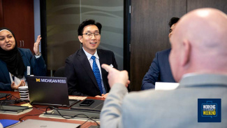 Part-Time MBA students discussing topics at a table