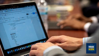 Student using laptop in class