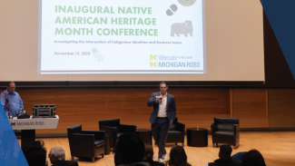 A speaker at the Native American Heritage Month event speaking on stage