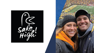 A woman and a man stand in the crowd in the Big House watching a Michigan football game. Beside their photo is the logo for their company, Sake High!, which is a bird outline with the name of the business below it.