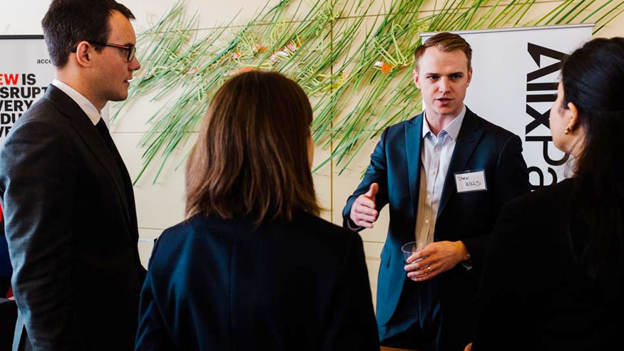 Consulting Club attendees talking in a group