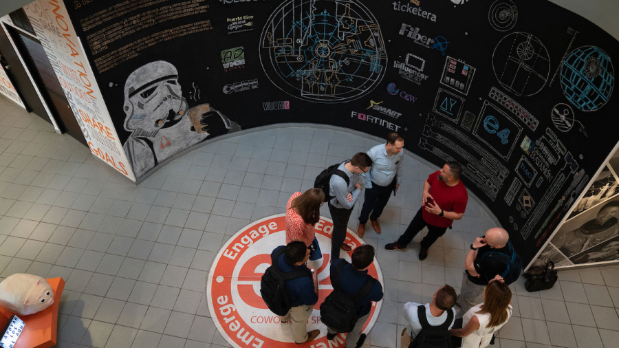 MAP course - students standing near giant chalkboard