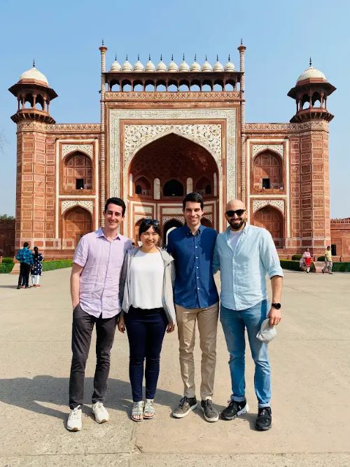 Students stand together in front of the Taj Mahal